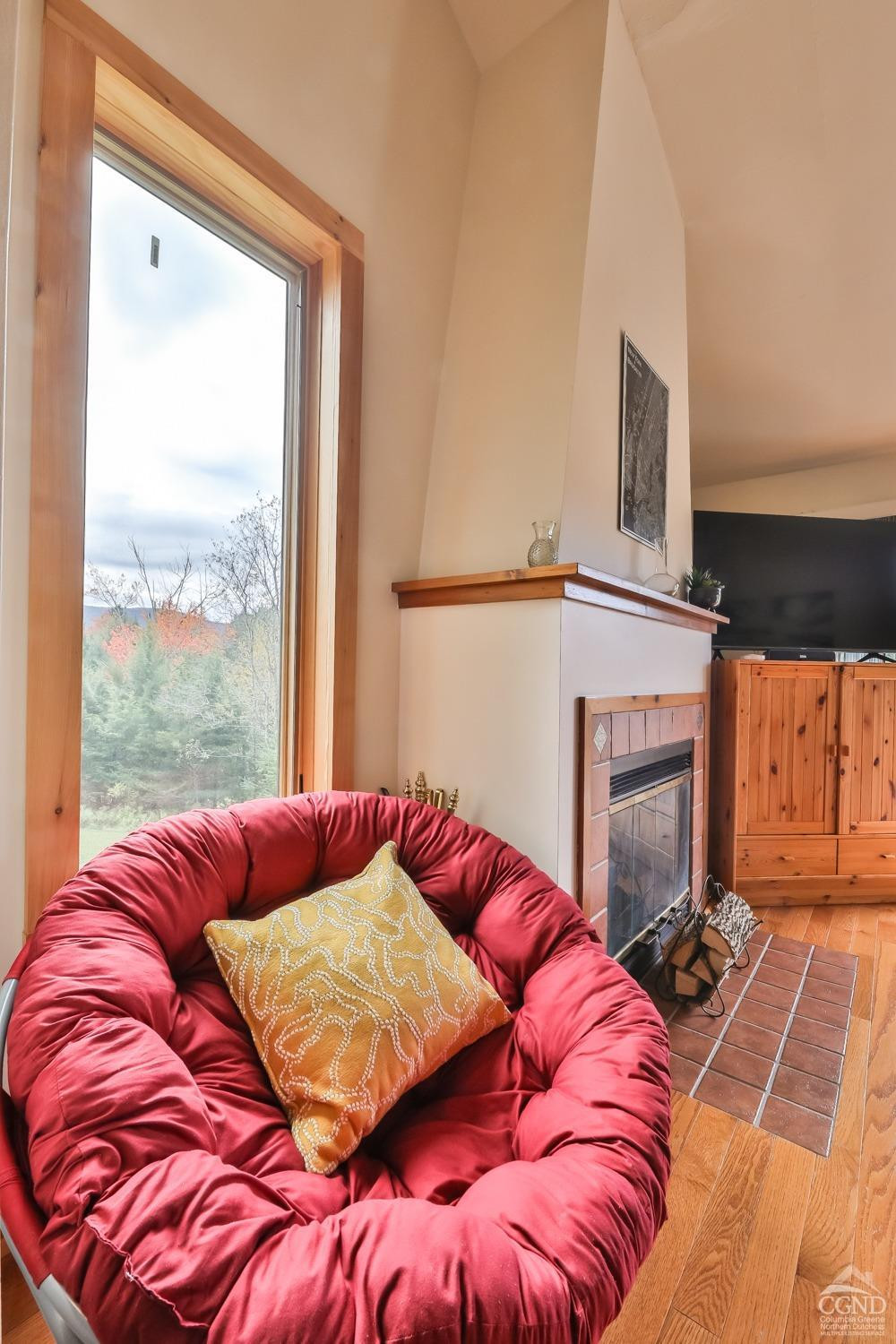 28-1 Loo Bridge Lane, Unit 22A Windham, NY 12496 - Photo 25 of 35 a bed with a bed and a fireplace