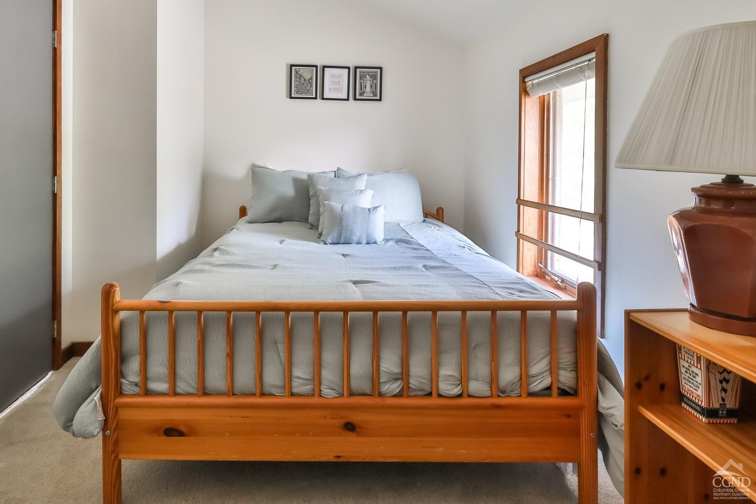 28-1 Loo Bridge Lane, Unit 22A Windham, NY 12496 - Photo 29 of 35 a bedroom with a bed and a window