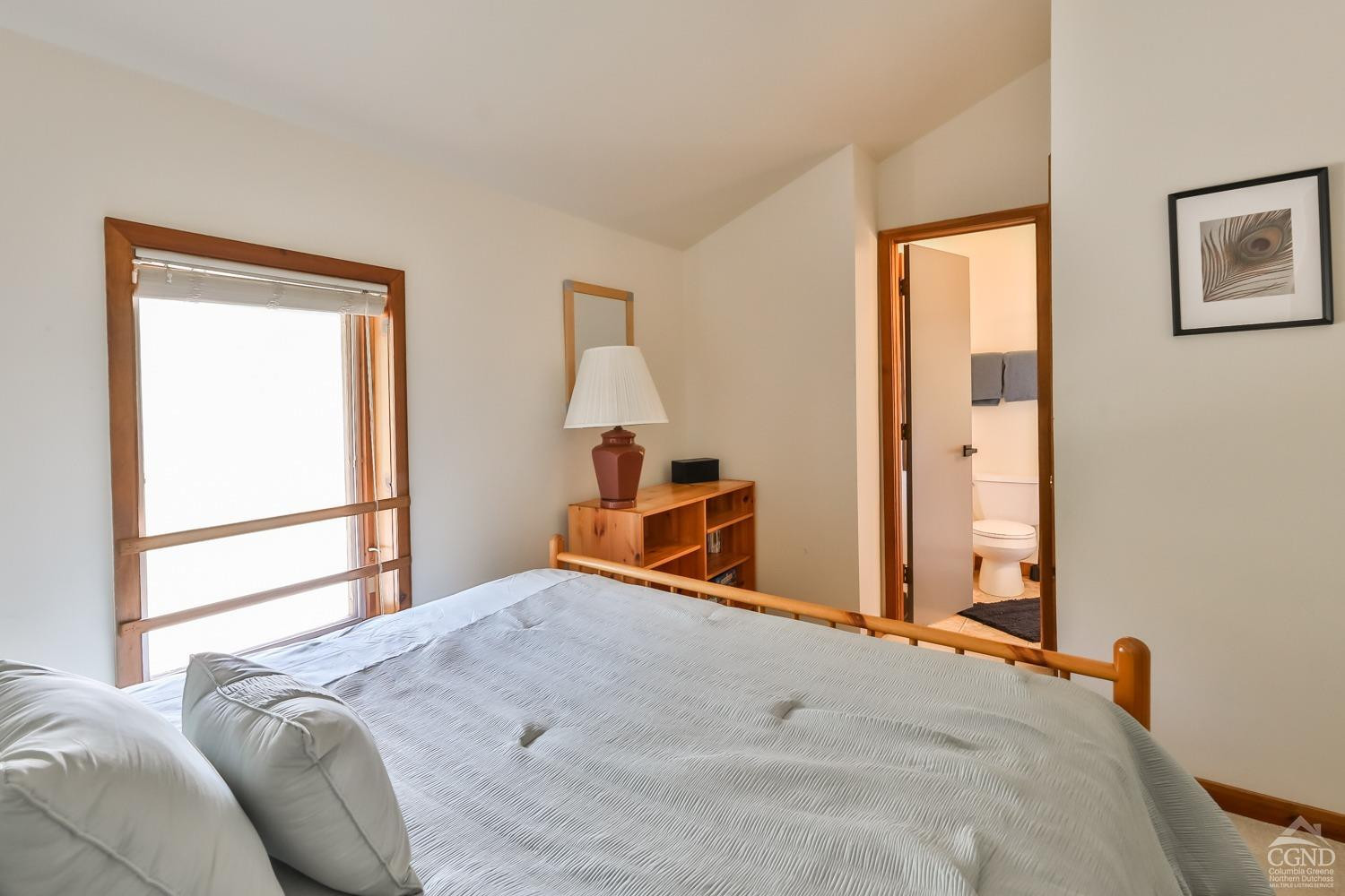 28-1 Loo Bridge Lane, Unit 22A Windham, NY 12496 - Photo 30 of 35 a bedroom with a bed and wooden floor