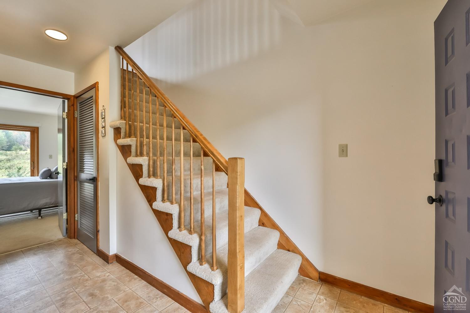 28-1 Loo Bridge Lane, Unit 22A Windham, NY 12496 - Photo 9 of 35 a view of a hallway with staircase