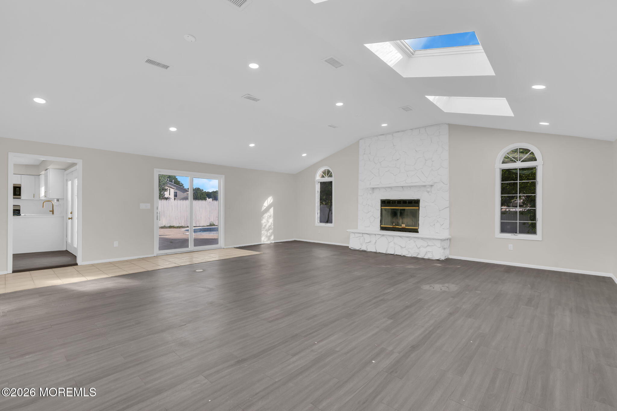 45 Peachstone Road Howell, NJ 07731 - Photo 44 of 54 an empty room with wooden floor and windows