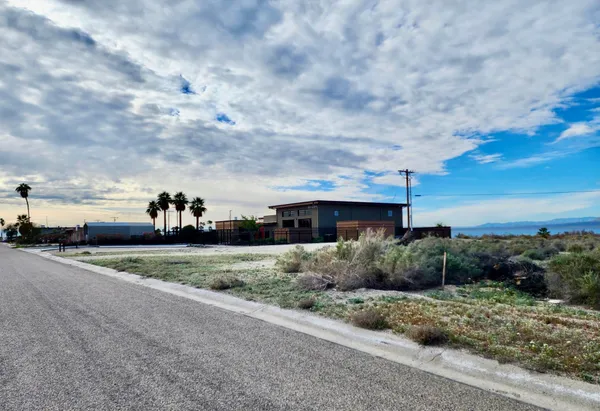 a view of a city street and ocean view