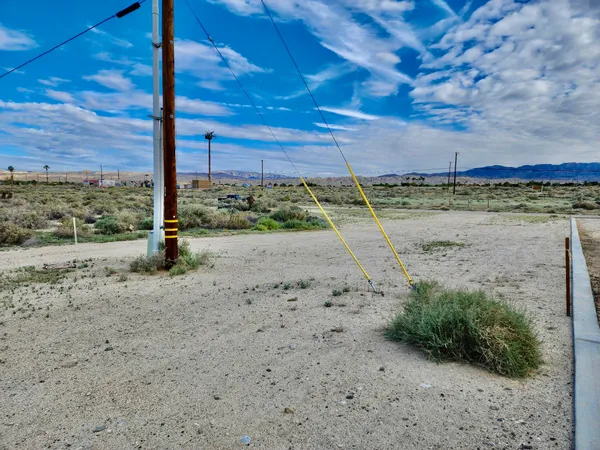 a view of a road with a big yard