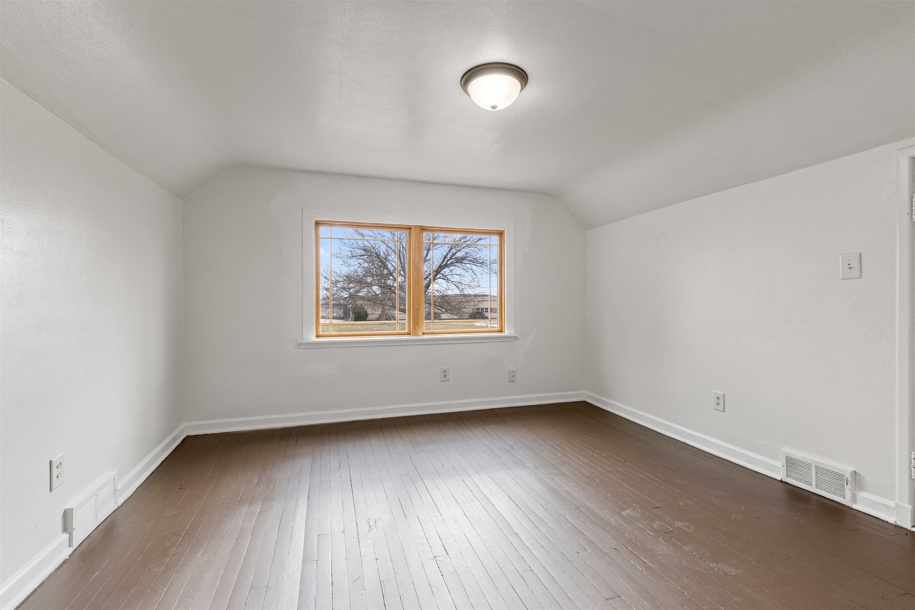 1214 Samuelson Road Rockford, IL 61109 - Photo 11 of 15 an empty room with wooden floor and windows