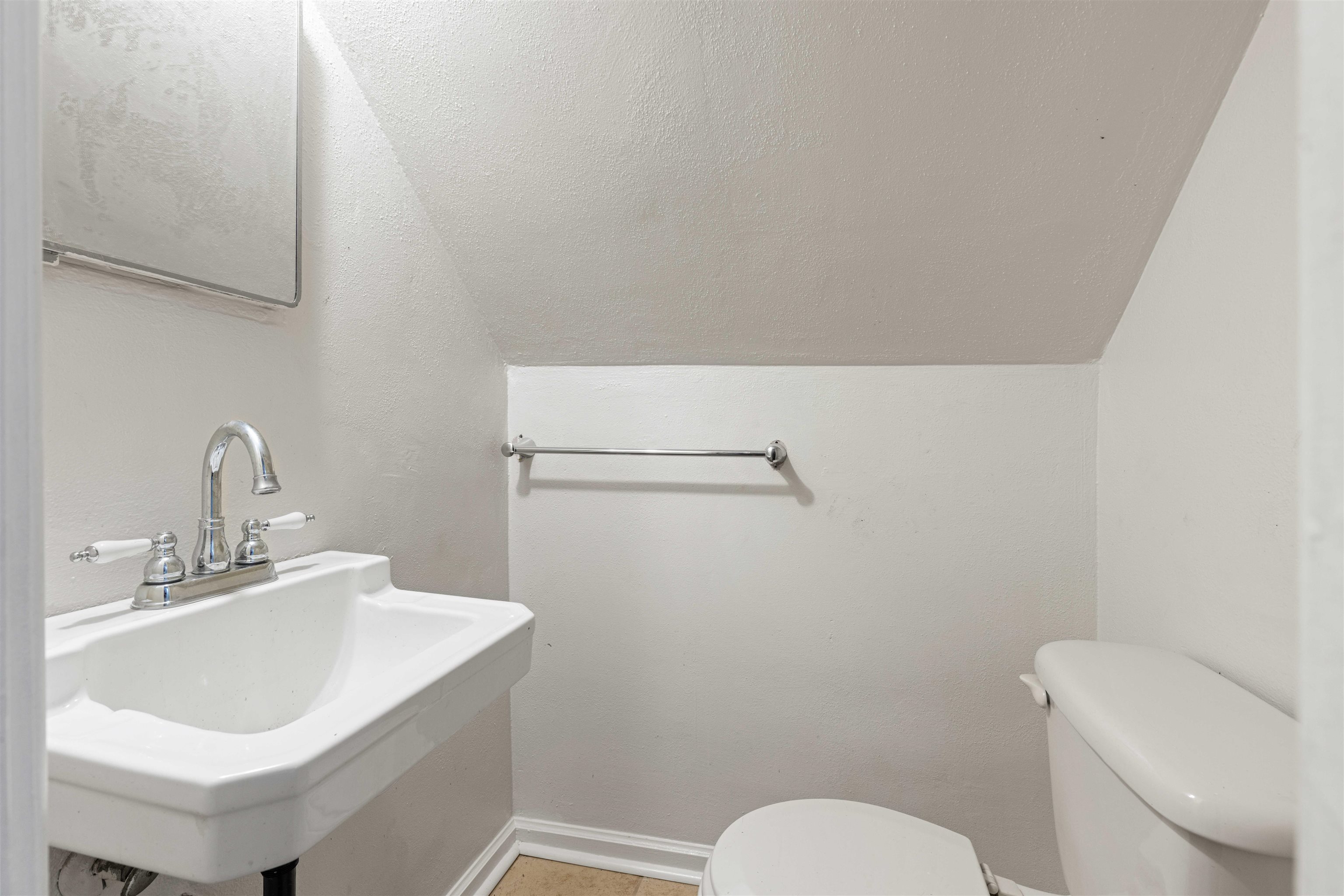 1214 Samuelson Road Rockford, IL 61109 - Photo 12 of 15 a bathroom with a sink and a toilet