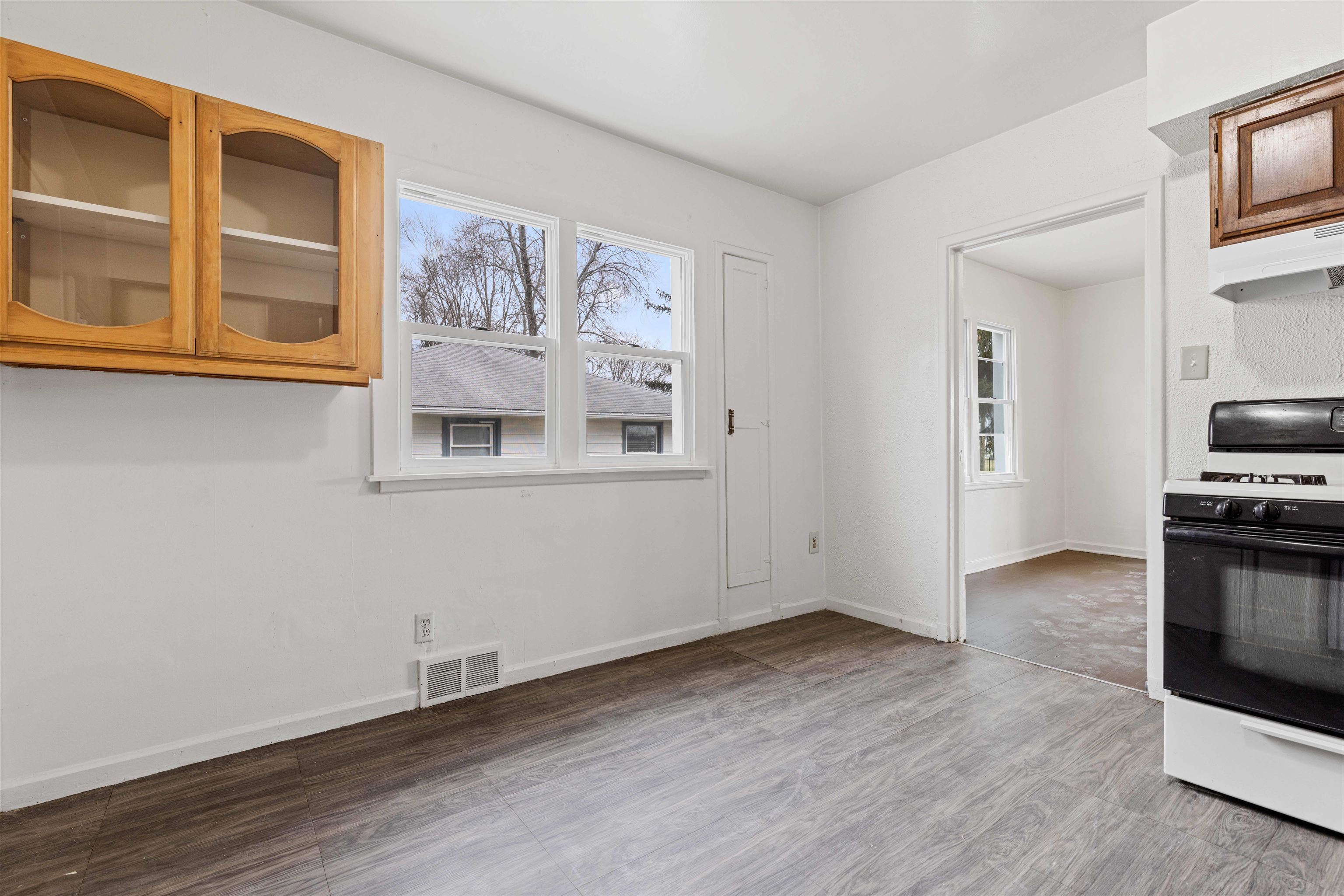 1214 Samuelson Road Rockford, IL 61109 - Photo 6 of 15 a view of a kitchen with wooden floor and electronic appliances