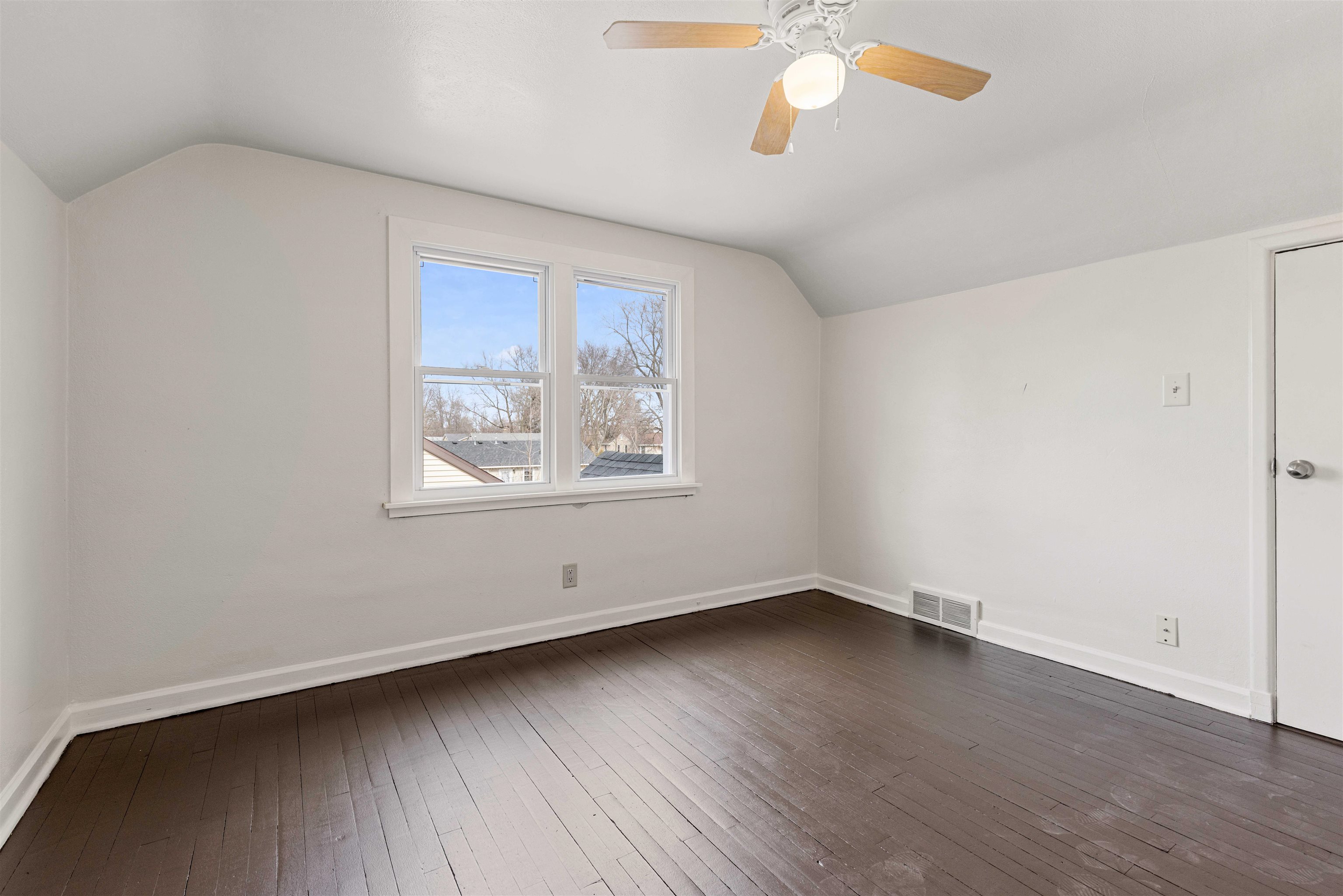 1214 Samuelson Road Rockford, IL 61109 - Photo 9 of 15 an empty room with wooden floor and windows