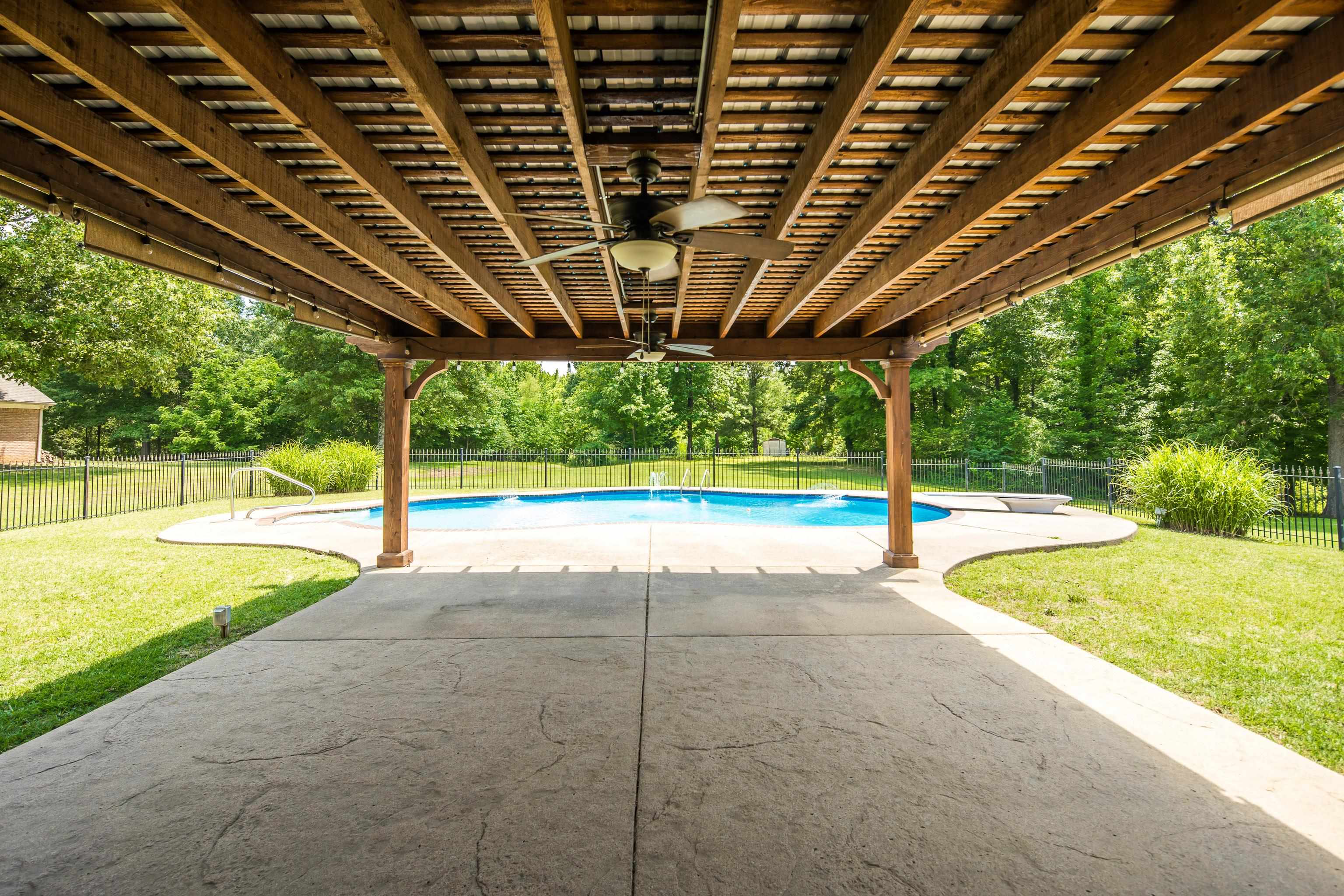 9028 Osborntown Road Arlington, TN 38002 - Photo 36 of 40 a view of a backyard with swimming pool