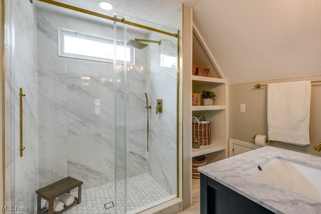2340 Canterbury Road University Heights, OH 44118 - Photo 24 of 29 Full bathroom with vanity, a marble finish shower, and vaulted ceiling