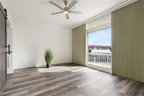 a view of livingroom with window and hardwood floor