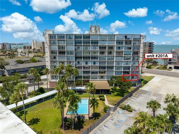 a view of a swimming pool with sitting area