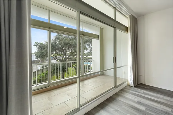 a view of an entryway with a floor to ceiling window