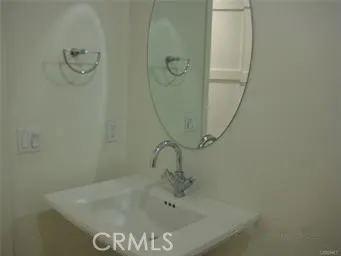 a bathroom with a sink and shower