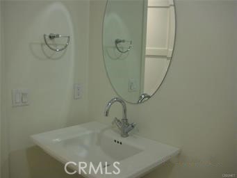 10878 Bloomfield Street, Unit 404 Toluca Lake, CA 91602 - Photo 18 of 36 a bathroom with a sink and shower