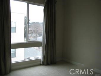 10878 Bloomfield Street, Unit 404 Toluca Lake, CA 91602 - Photo 25 of 36 a view of an empty room and a window