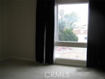 10878 Bloomfield Street, Unit 404 Toluca Lake, CA 91602 - Photo 26 of 36 a view of an empty room and a window