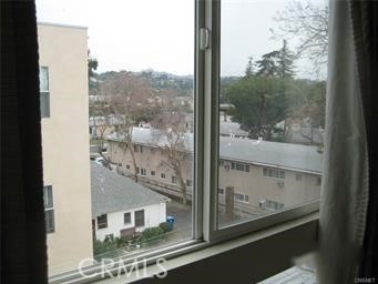 10878 Bloomfield Street, Unit 404 Toluca Lake, CA 91602 - Photo 27 of 36 a view of a glass door and a window