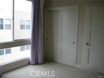 10878 Bloomfield Street, Unit 404 Toluca Lake, CA 91602 - Photo 32 of 36 a view of an empty room with a window