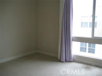 10878 Bloomfield Street, Unit 404 Toluca Lake, CA 91602 - Photo 33 of 36 an empty room with a window