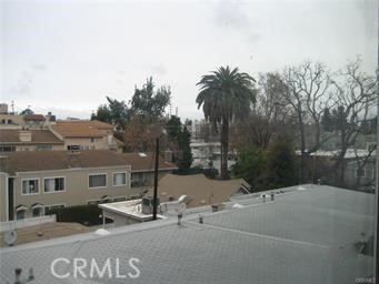 10878 Bloomfield Street, Unit 404 Toluca Lake, CA 91602 - Photo 35 of 36 a view of a street with a building in the background
