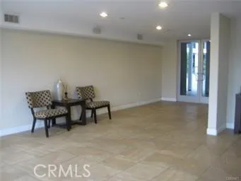 a view of work space with furniture and windows