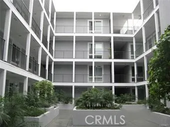 a front view of a building with a yard