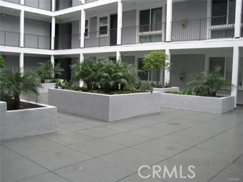 10878 Bloomfield Street, Unit 404 Toluca Lake, CA 91602 - Photo 8 of 36 a view of white house with entrance