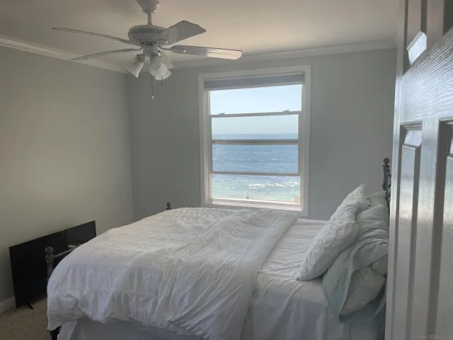 a bedroom with a bed and a walk in closet