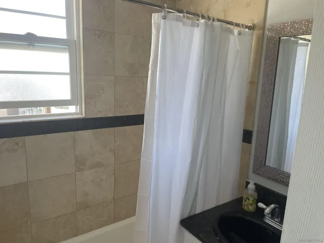 a close view of utility room with washer and dryer