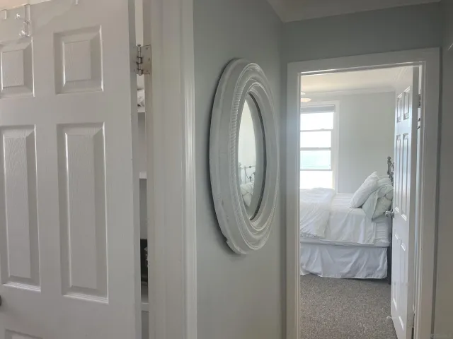 a bedroom with a bed and a desk