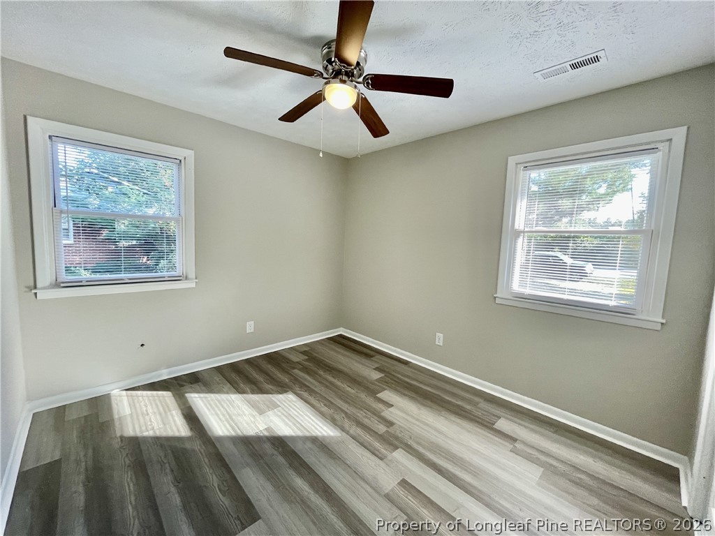 5985 McDonald Road Parkton, NC 28371 - Photo 14 of 20 a view of room with window and ceiling fan