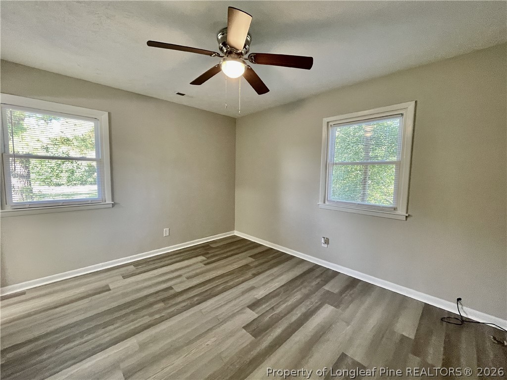 5985 McDonald Road Parkton, NC 28371 - Photo 16 of 20 a view of room with window and ceiling fan