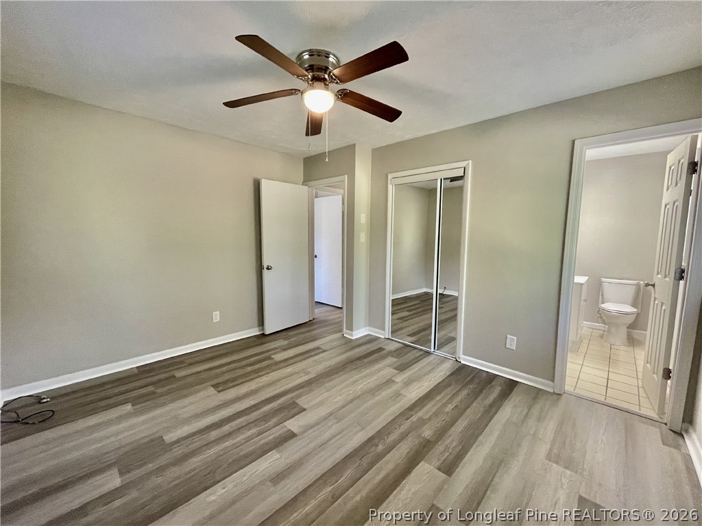 5985 McDonald Road Parkton, NC 28371 - Photo 18 of 20 an empty room with wooden floor and a ceiling fan