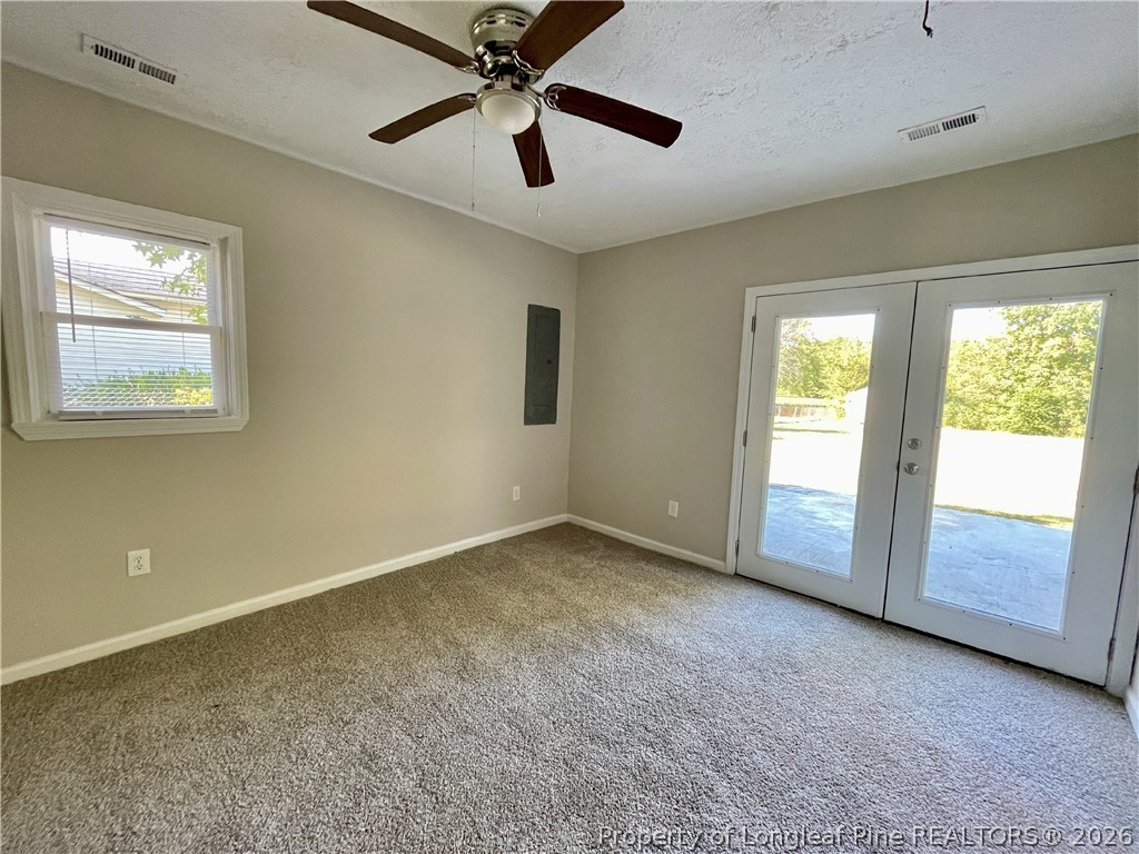 5985 McDonald Road Parkton, NC 28371 - Photo 6 of 20 a view of an empty room with a window