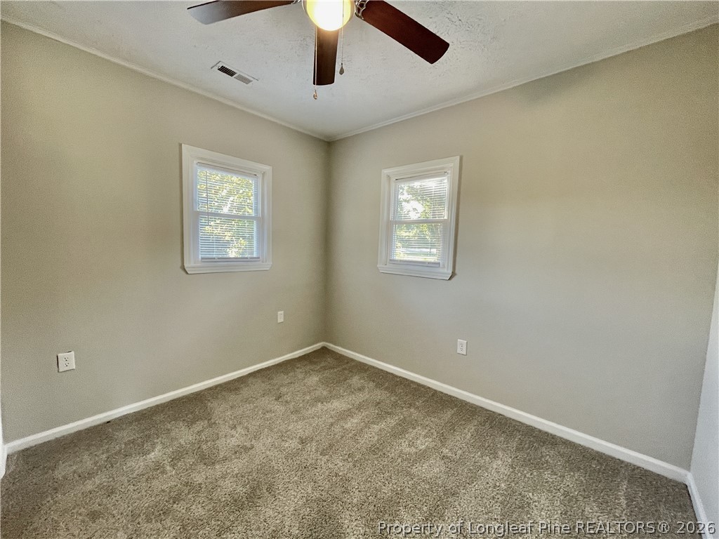 5985 McDonald Road Parkton, NC 28371 - Photo 8 of 20 a view of an empty room with a window