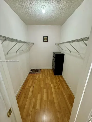 front view of a house with a swimming pool and a chair