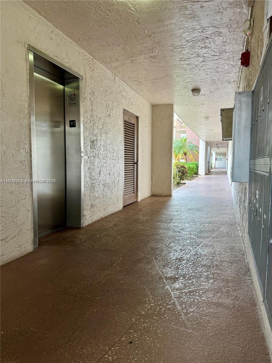 7060 Nova Drive, Unit 306C Davie, FL 33317 - Photo 15 of 17 an empty room with windows