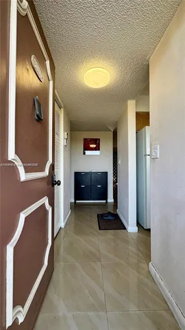 a view of lobby with mirror