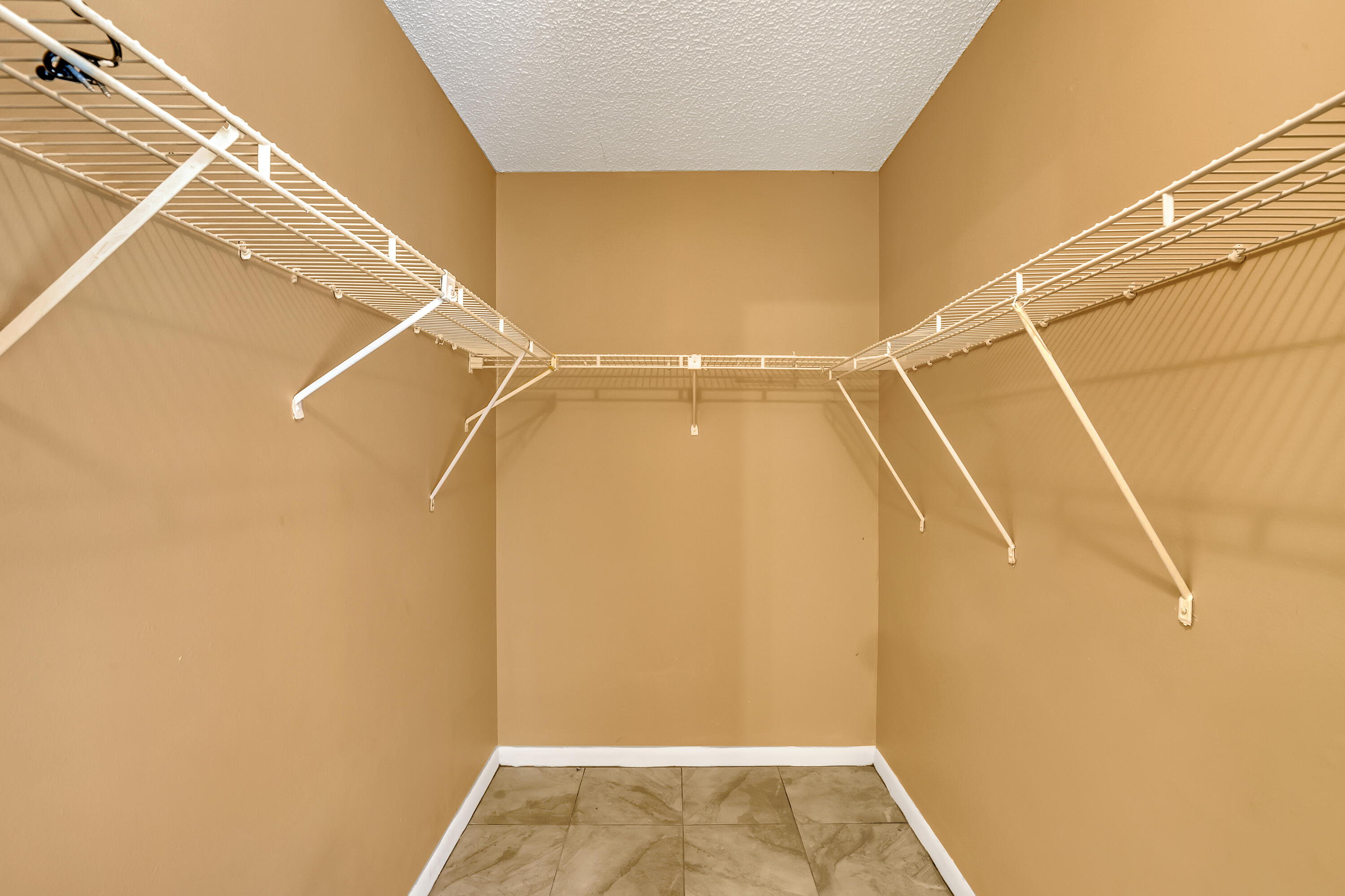6257 Chasewood Drive, Unit B Jupiter, FL 33458 - Photo 18 of 36 a view of walk in closet