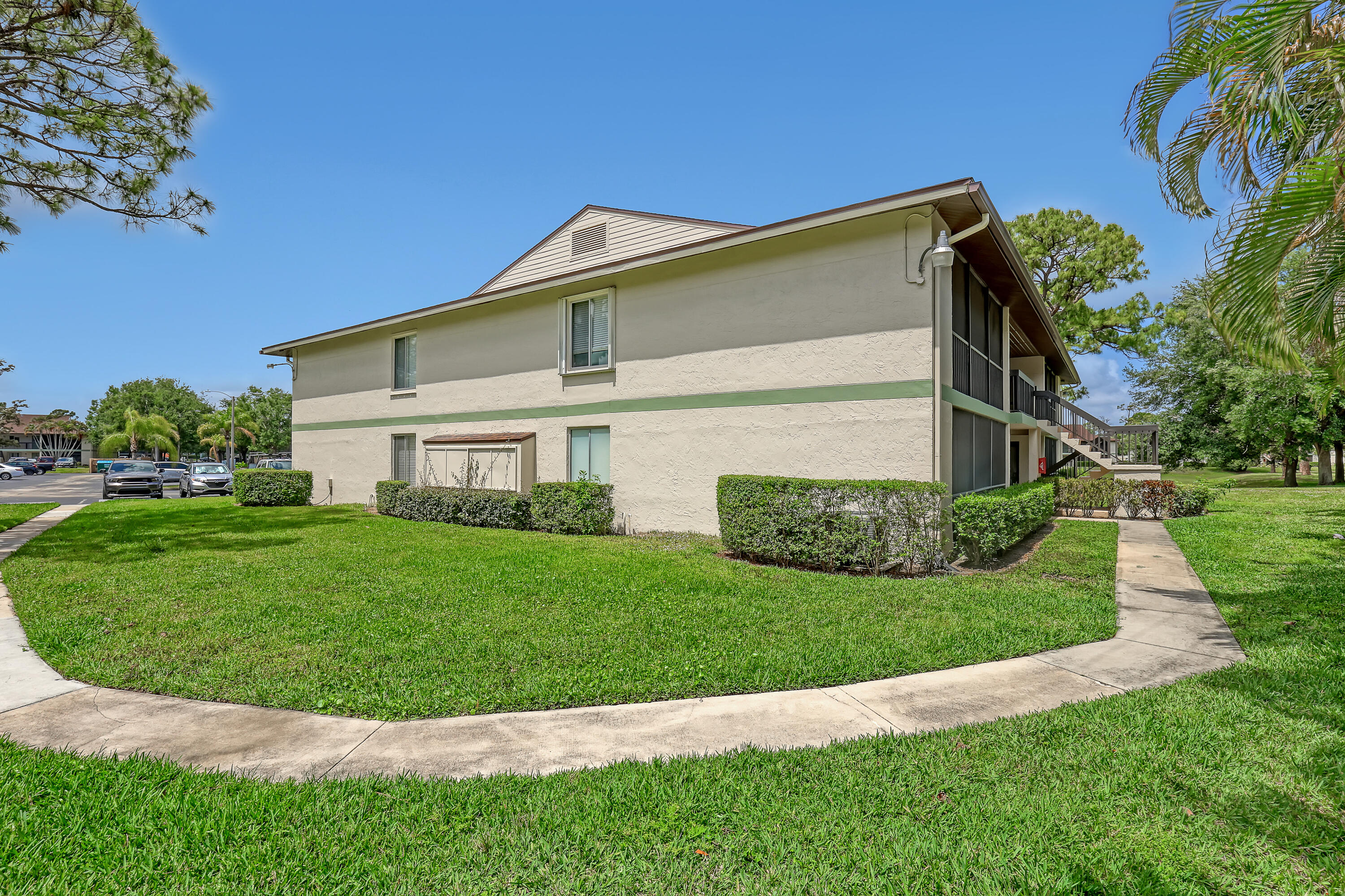 6257 Chasewood Drive, Unit B Jupiter, FL 33458 - Photo 25 of 36 a view of a house with a yard
