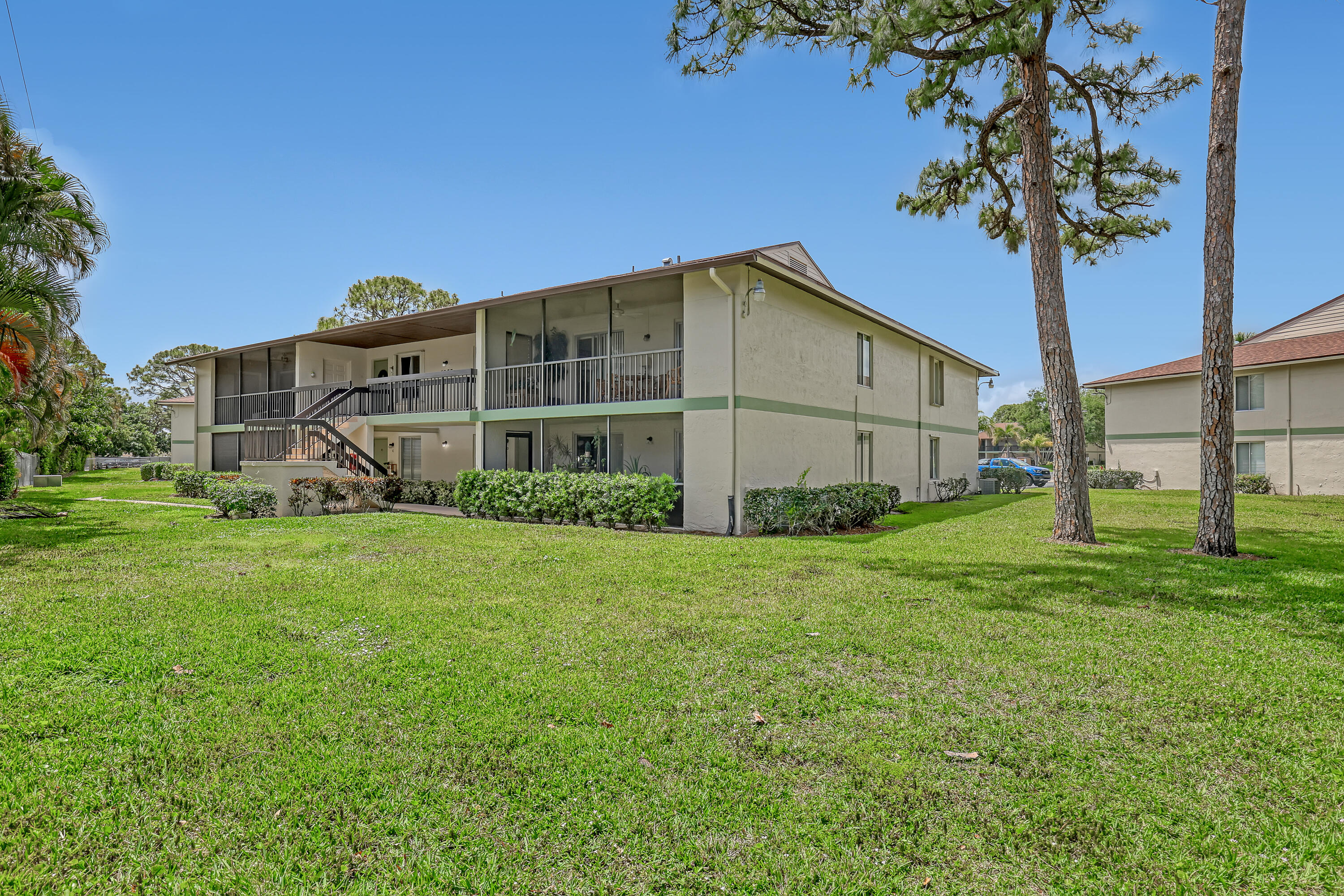 6257 Chasewood Drive, Unit B Jupiter, FL 33458 - Photo 26 of 36 a view of a house with backyard and garden