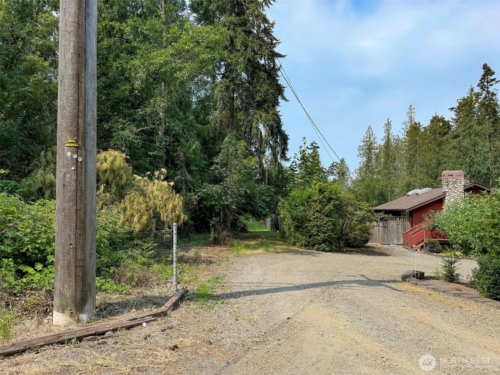 319 Reservoir Road Sequim, WA 98382 - Photo 26 of 38 a view of a house with a tree in the background