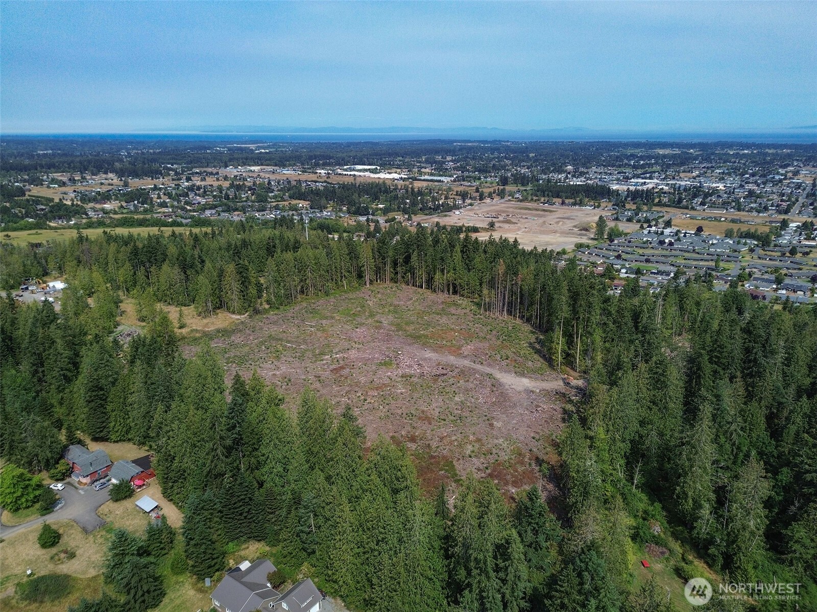 319 Reservoir Road Sequim, WA 98382 - Photo 32 of 38 a view of a lake with a city