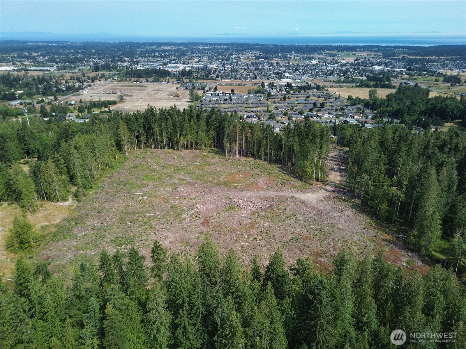 319 Reservoir Road Sequim, WA 98382 - Photo 33 of 38 a view of a lake with a city