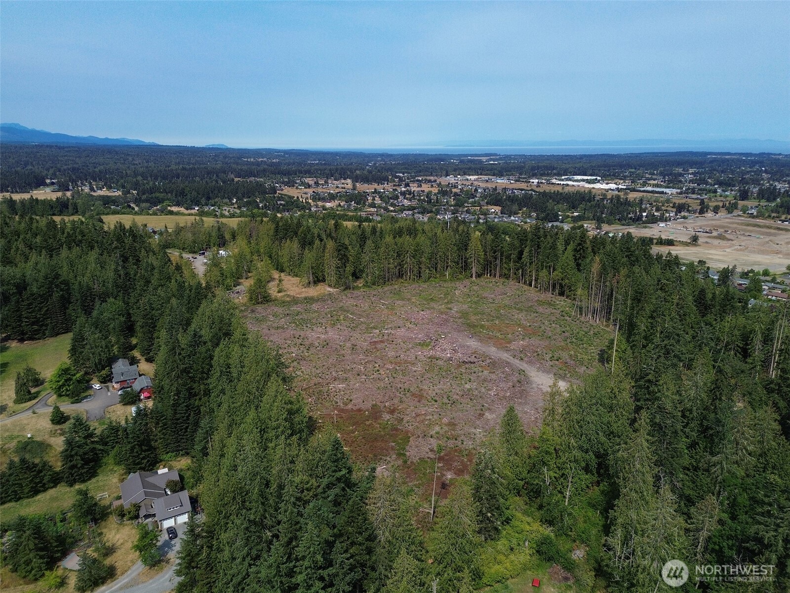 319 Reservoir Road Sequim, WA 98382 - Photo 34 of 38 a view of a city with a lake