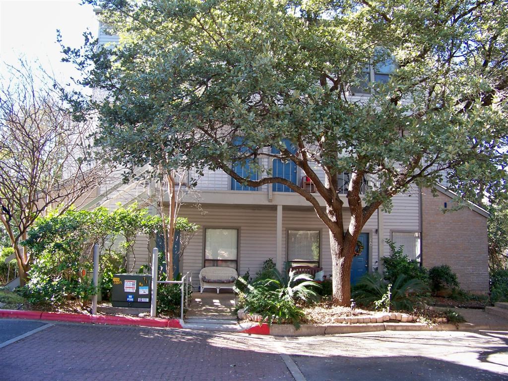 802 South 1st Street, Unit 217 Austin, TX 78704 - Photo 1 of 16 front view of a house with a tree