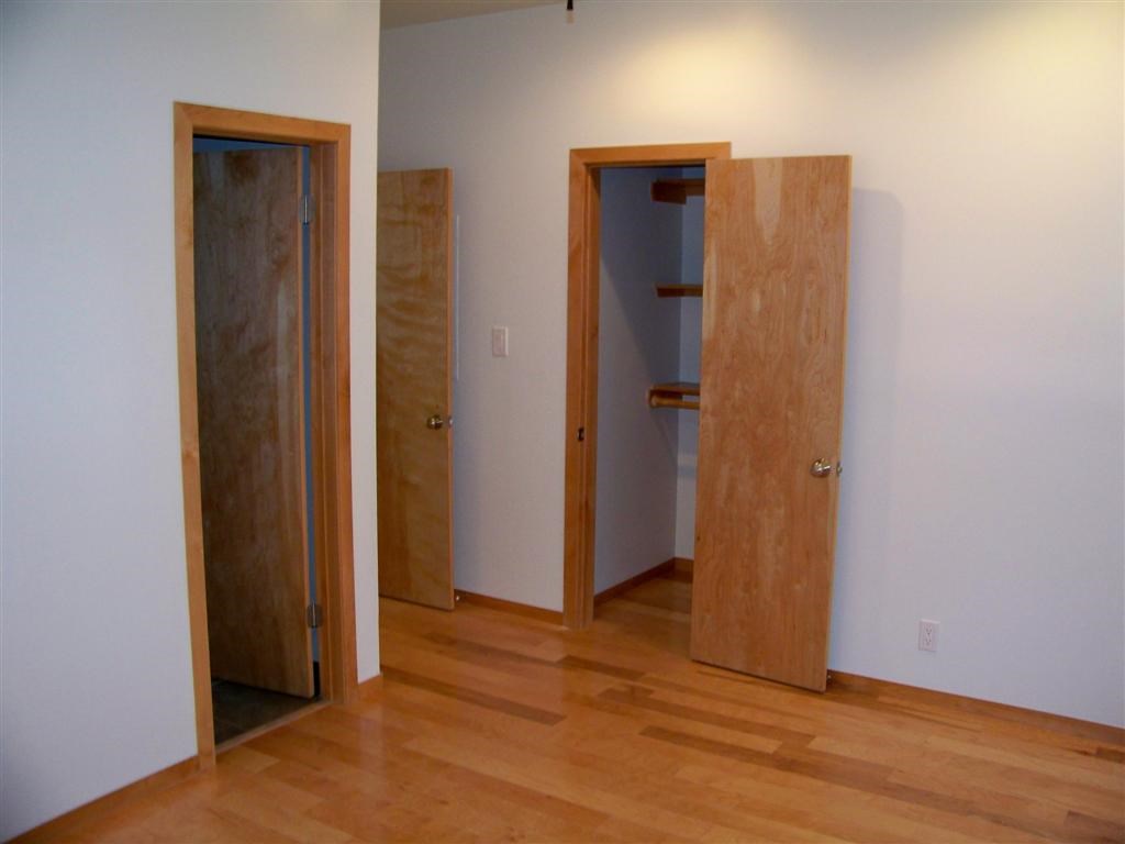 802 South 1st Street, Unit 217 Austin, TX 78704 - Photo 13 of 16 a view of a hallway with wooden floor