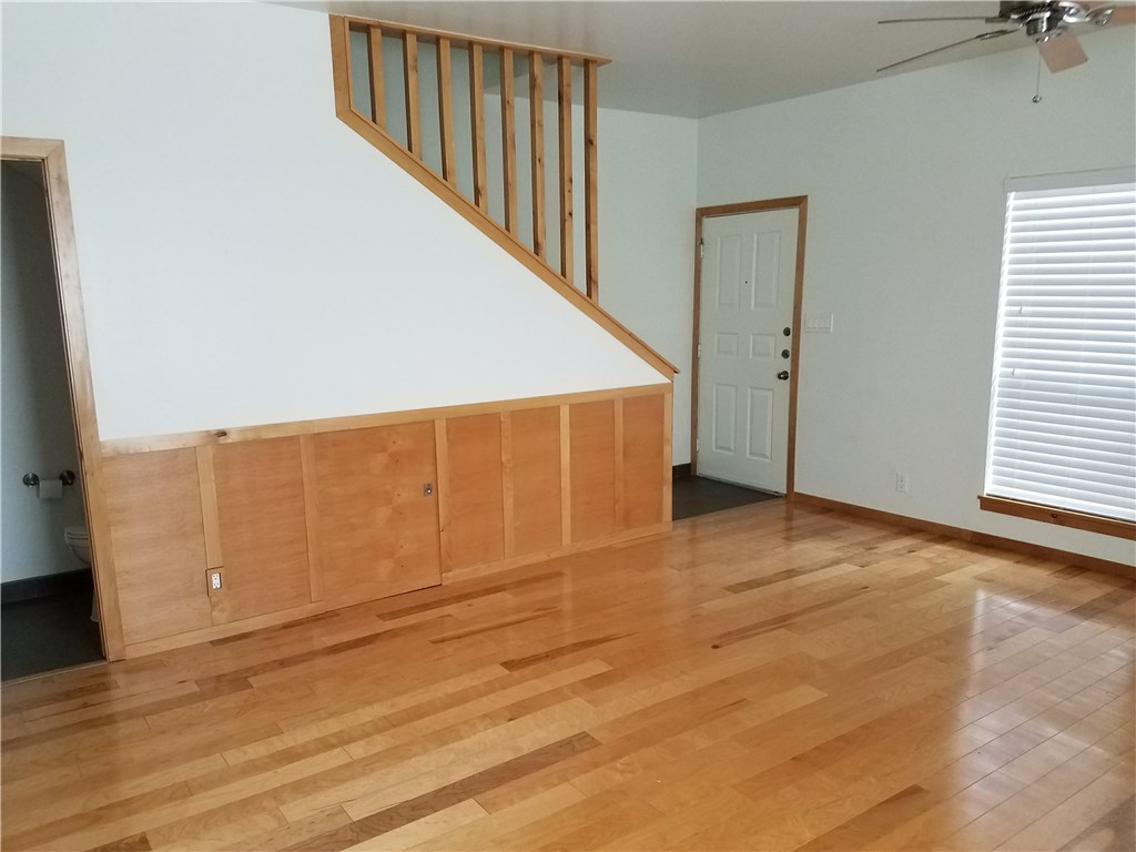 802 South 1st Street, Unit 217 Austin, TX 78704 - Photo 4 of 16 a view of an empty room with wooden floor