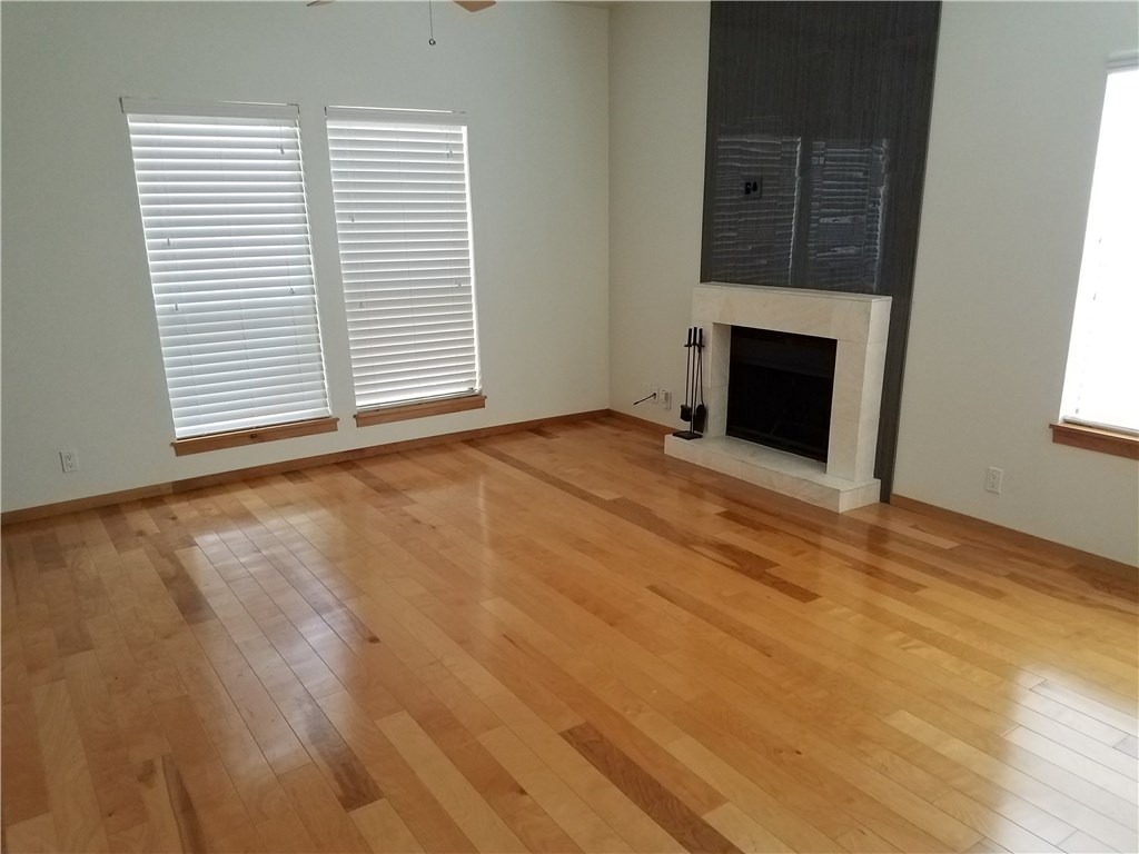 802 South 1st Street, Unit 217 Austin, TX 78704 - Photo 5 of 16 a view of empty room with fireplace