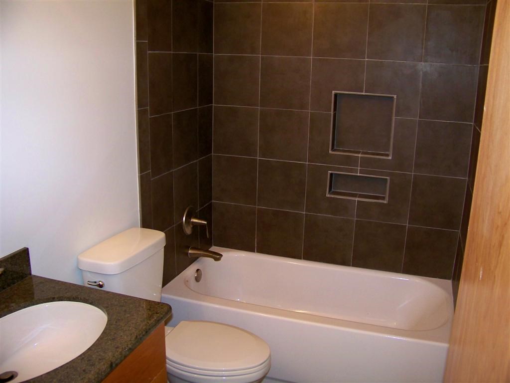 802 South 1st Street, Unit 217 Austin, TX 78704 - Photo 9 of 16 a bathroom with a toilet a sink and bathtub